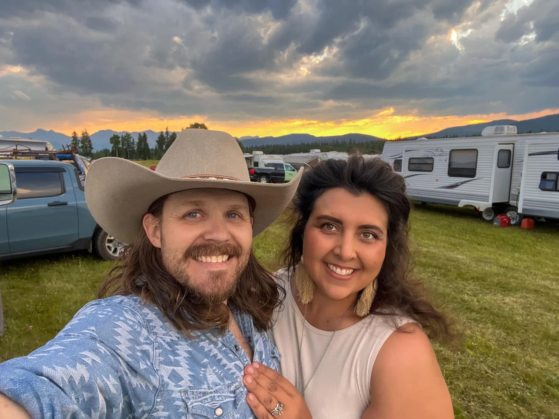 Brody Bestluck and his wife smiling together at sunset
